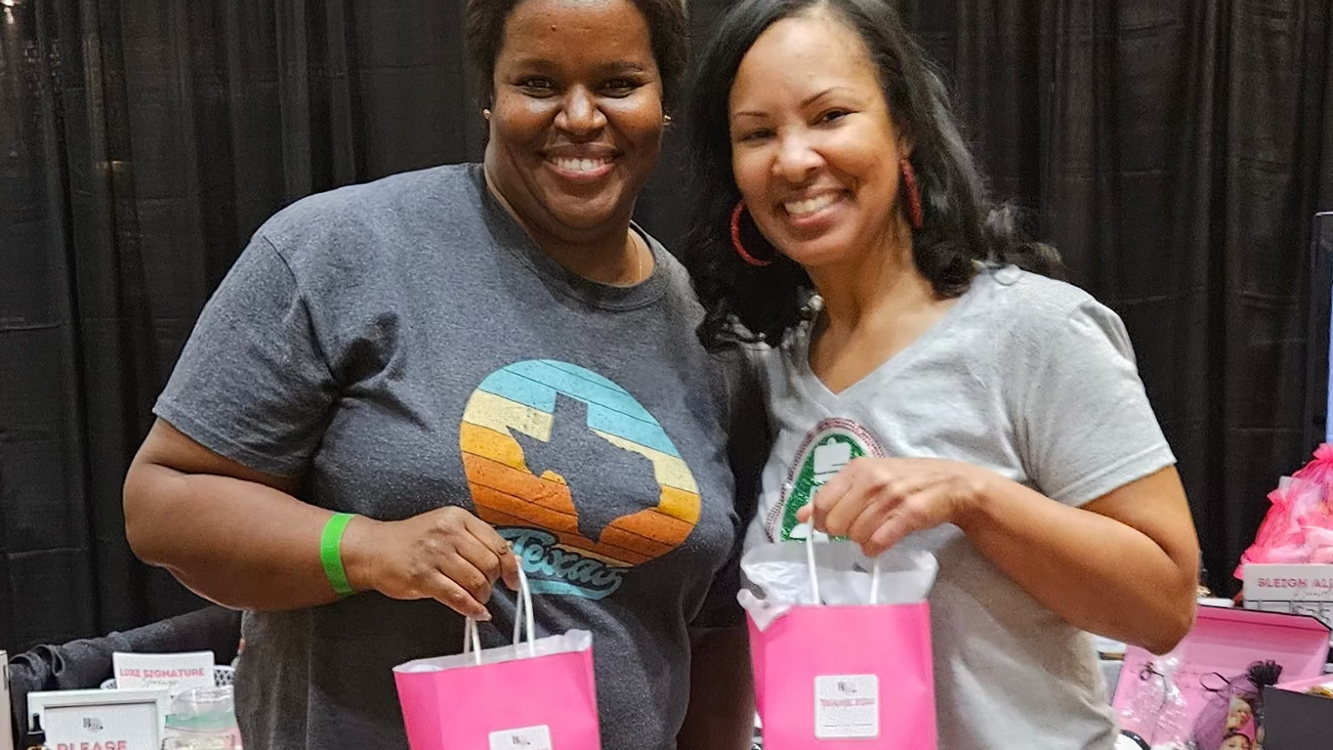 Skinfolk customers holding by A’amia shopping bags at the Holiday Soul Market.