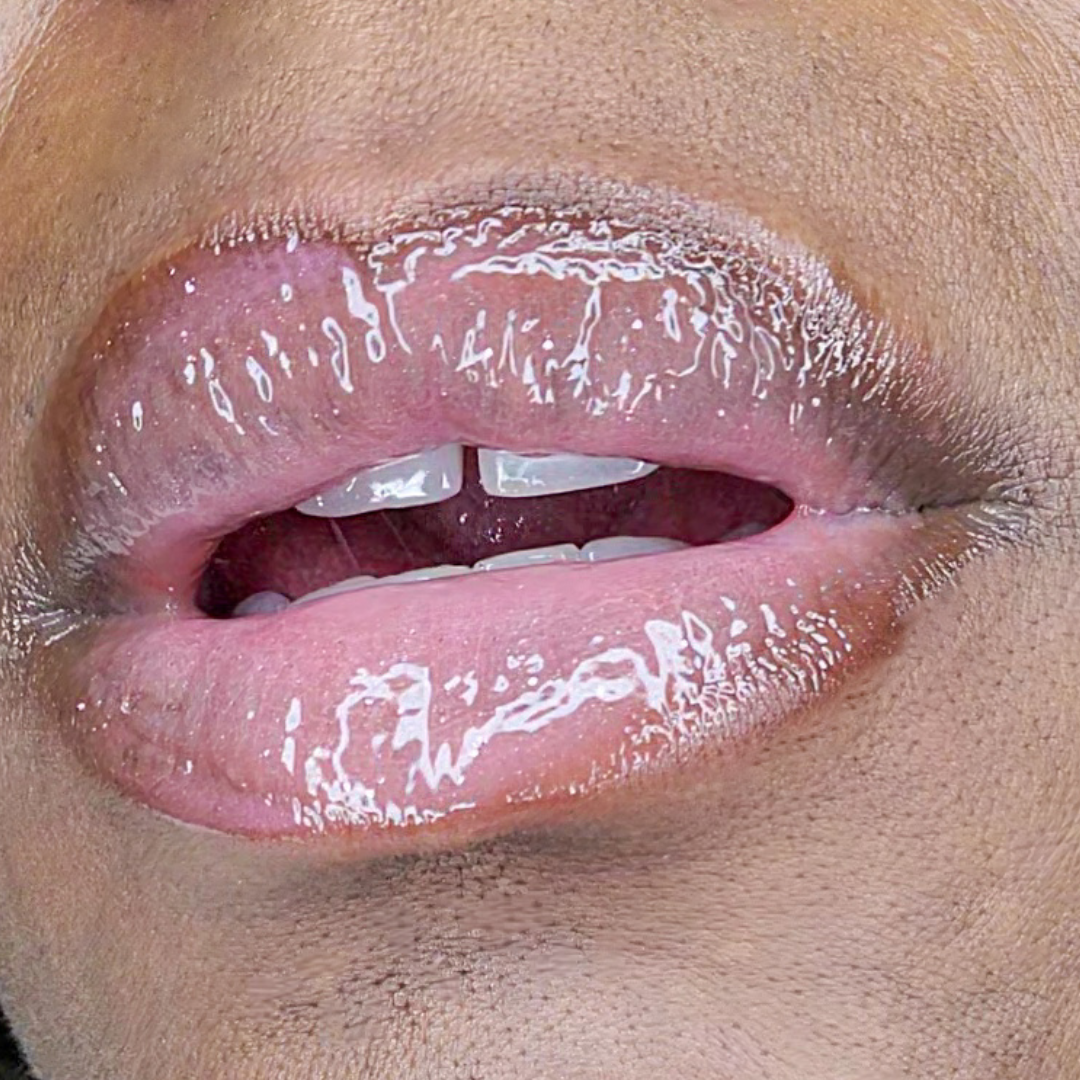 Bubble Gum Glow Glitter Gloss on softly parted lips
