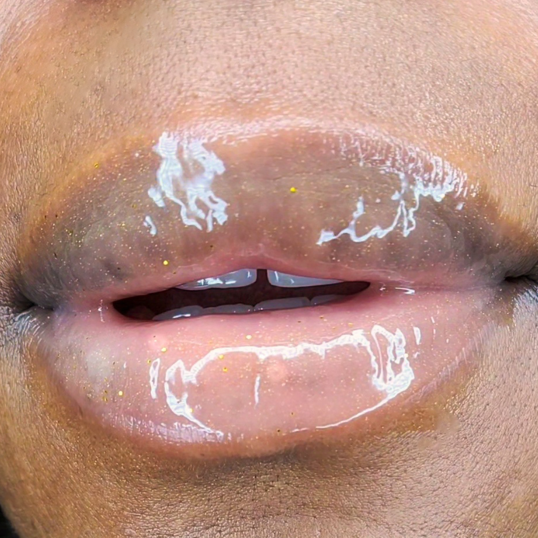 24K Glitter Gloss shown close up on softly parted lips
