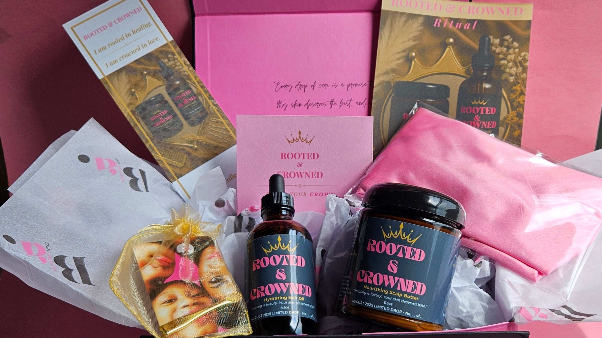 Luxury Rooted & Crowned scalp care gift set featuring Hydrating Hair Oil, Nourishing Scalp Butter, ritual guide, affirmation card, silk pink wrap, and branded packaging — designed for scalp eczema, dryness, and protective style aftercare.