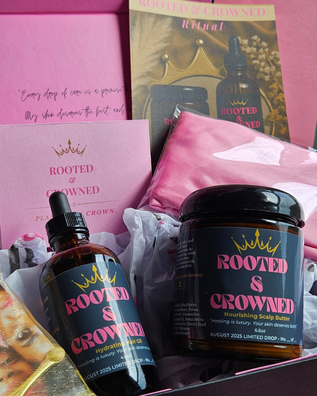 Rooted & Crowned scalp care bundle with Hydrating Hair Oil, Nourishing Scalp Butter, and Planting Your Crown ritual card displayed in a luxury pink gift box.