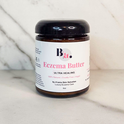Front-facing by A’amia Eczema Butter in its amber 6-ounce jar with a black lid and white label.