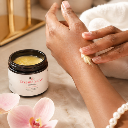 by A’amia Eczema Salve being applied in a small amount for the targeted care step of the Soothing Summer Bundle.