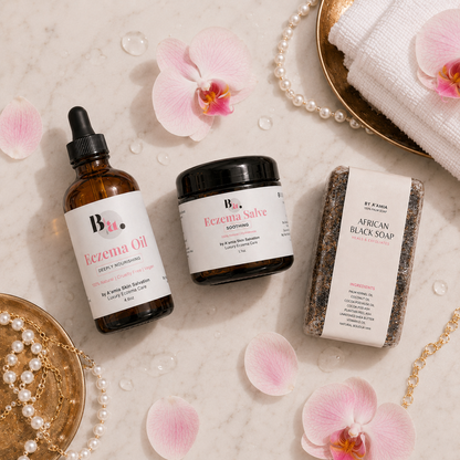 Flat lay of the by A’amia Soothing Summer Bundle with African Black Soap, Eczema Oil, and Eczema Salve.
