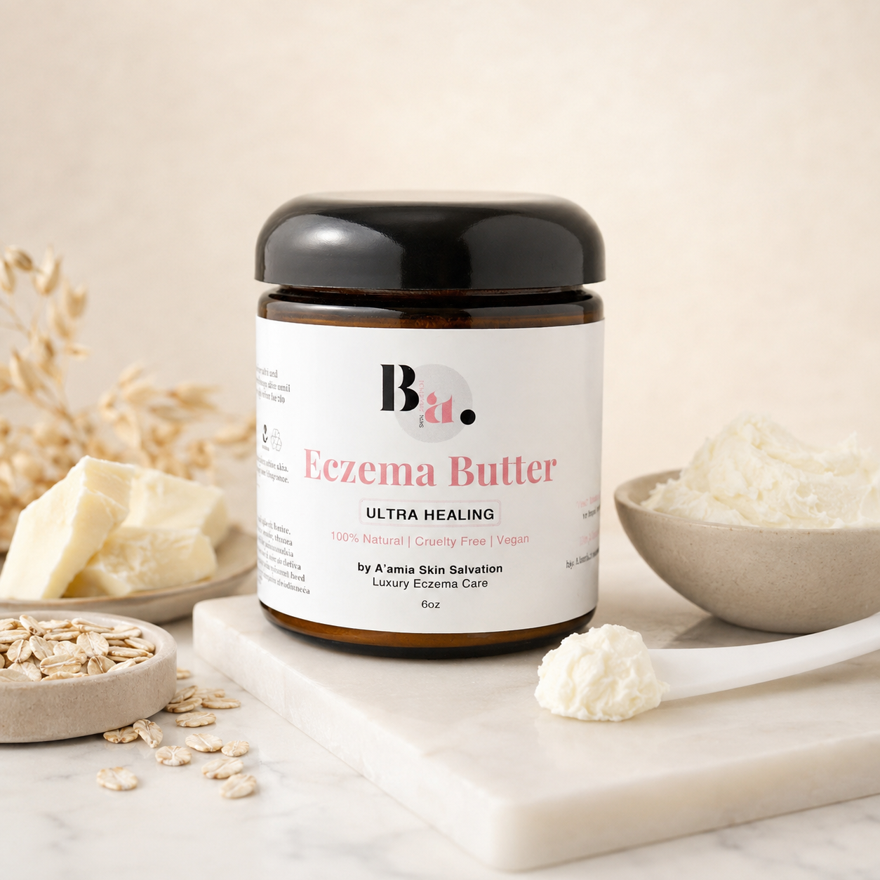 by A’amia Eczema Butter shown with colloidal oatmeal, butter texture, and a spatula in a restrained ingredient still life.